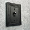 Filigree Border Matte Black Cast - 3 Rocker Wallplate